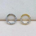 Detail view of gold and silver F136 titanium clicker rings with marquise cut cubic zirconia - Mixed Cut Zirconia Fan Style (2311240009)