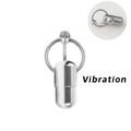 Macro detail van vibrerende roestvrijstalen ring met capsule hanger voor body piercing - Trillende Capsule Stijl
