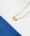 Macro detail of golden heart pendant featuring engraved letter I on a classic O-chain link - Gold Letter A Style (JC1037G-A)