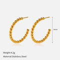 Detail shot of 30mm twisted C-shape earrings in gold stainless steel finish - C-Shape Hoop / Gold