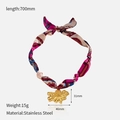 Detailed view of floral stainless steel pendant with colorful silk scarf ribbon necklace - Gold Flower Style (CH1472)