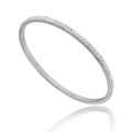 Macro detail of silver stainless steel bangle with rainbow pavé rhinestones and reflection - AB Color