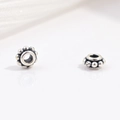 Macro shot of S925 sterling silver faceted beads with vintage oxidized floral texture - 3D Bead Wrapped Style (Model D)