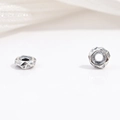 Macro shot of vintage S925 sterling silver faceted gear beads for DIY jewelry - Polyhedral Flat Round Style (Model I)