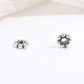 Close-up of retro S925 sterling silver flower spacer beads with oxidized vintage finish - Sulfurized Petal Style (Model L)