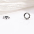 Macro view of vintage S925 sterling silver faceted gear beads with floral engravings - Vintage Engraved Style (Model M)