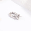 Close-up of S925 sterling silver pearl pendant bail with micro-paved zircon detail - Nipple Bail / White Gold Pacifier Style