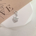 Detailed view of S925 silver heart pendant with green crown and sparkling zircon stones - Style G