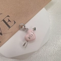Macro detail of S925 silver Cupid arrow charm with pink enamel heart and Kiss engraving - Style F
