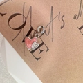 Detailed close-up of S925 silver double heart charm with pink enamel and sparkling stones - Style J