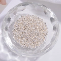 DIY jewelry making supplies featuring polished S925 silver irregular flat beads in a glass bowl - 2.7*3mm (1g/Pack)