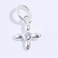 Macro detail of S925 silver four-petal flower cross pendant with white zircon inlay - Silver Zirconia Vajra Pestle Pendant
