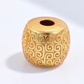 Macro shot of S925 sterling silver cylinder bead with engraved patterns in gold finish - Fret Pattern Round Bead