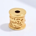 Macro shot of gold S925 sterling silver cylinder bead with relief Chinese characters - Blessing Barrel Bead
