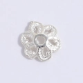 Macro detail of S925 silver snowflake spacer bead for DIY jewelry bracelet making - Silver 6-Petal Hollow Flower Cap