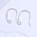 Macro shot of polished S925 sterling silver U-shaped earring hooks for DIY jewelry making - Silver