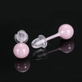 Roze ronde keramische oorknopjes 8mm met glad gepolijste afwerking en siliconen sluiting - Roze
