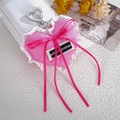 Pink heart-shaped denim charm with white lace trim and a Wednesday woven label - Rose Red
