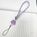 Detail of hand-woven purple flower phone charm with enamel petals and rhinestone center - Woven Rope Small Flower Purple (K6152)