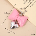 Pink faux leather bow keychain with a silver metal heart and star-shaped clip - Barbie Pink (K3692)