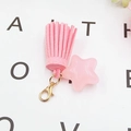 Detailed view of pink star pendant with suede tassel and golden lobster clasp - Star Tassel Charm (K1449) / Pink