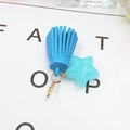 Detail of candy color star pendant with blue suede tassel and gold ring connectors - Blue with Blue Star