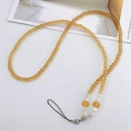 Detail of amber crystal beaded phone lanyard with polished faceted beads and silver clasp - Champagne (K6145)