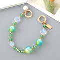 Macro shot of green crystal beads and iridescent pearls for mobile phone charm strap - Iridescent Flower Beaded Hand Chain (Pearl Hanging) Green (K4529)