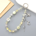 Handmade beaded phone strap with yellow crystal stars and moon pendants on silver ring - Yellow