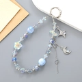 Star and moon beaded phone charm in light blue with iridescent crystal star accents - Blue