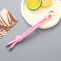 Detail view of a pink hand-woven nylon keychain with a silver metal spring clasp - Pink