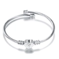 Detail of silver twisted cable bracelet featuring heart charm with engraved letter n - Letter A / Silver