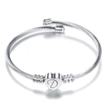 Silver stainless steel cable wire bracelet featuring heart pendant with letter D engraving - Letter D / Silver