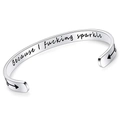 Detailed close-up of 6mm silver stainless steel cuff engraved with Because I fucking sparkle - Because I fucking sparkle