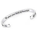 Detailed view of 'Be your own kind of beautiful' engraving on silver cuff bracelet - Be your own kind of beautiful