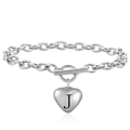 Macro shot of silver stainless steel heart pendant with letter J and toggle clasp detail - Letter J