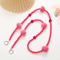 Pink plush ball and beaded crossbody phone strap with silver metal rings on a white background - Clearance Item (K2287) / Rose Red