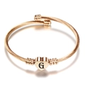 Roségoud roestvrijstalen kabelarmband met hartvormige bedel en gegraveerde letter G - Initiaal G