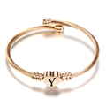 Roségouden gedraaide kabelarmband met een hartvormige bedel en gravure letter Y - Initiaal Y