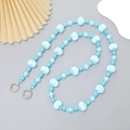 Light blue beaded phone strap with fuzzy pom-poms and metal rings for accessories - Plush Ball Crossbody Chain (K2760)