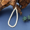 Macro detail of white Bodhi root beads on rustic wood with deep blue background - Phone Chain / K3409 Bodhi Seed Phone Chain