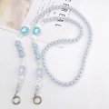 Close-up of light blue beaded phone strap with silver butterfly charms and heart accents - Blue