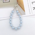Detail view of light blue double-layered acrylic beaded keychain with silver lobster clasp - Bead-in-Bead Pendant / Blue