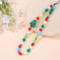 Macro shot of colorful beaded phone strap featuring a festive green Christmas tree charm - Large And Small Beaded Christmas Tree Style (K1641)