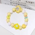 Detail of sweet beaded keychain with yellow sunflowers, rainbow beads and heart charms - Yellow Flower