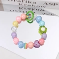 Detail of colorful acrylic bead strap with rainbow charms and purple heart pendant - Grass Green Flower Multicolor Beads
