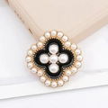 Macro detail of vintage floral accessory with black enamel and embedded white pearls - D1040 Pearl Clover (Black)