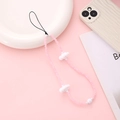 Pink beaded phone charm with white cloud accents on soft pink aesthetic background - Pink