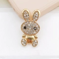 Detailed view of a gold-plated rabbit charm featuring white rhinestones and black gem eyes - Gold Rabbit