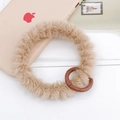 Detail view of light brown plush wrist strap with a round clasp for phone cases - Wristband / Khaki (K1918)